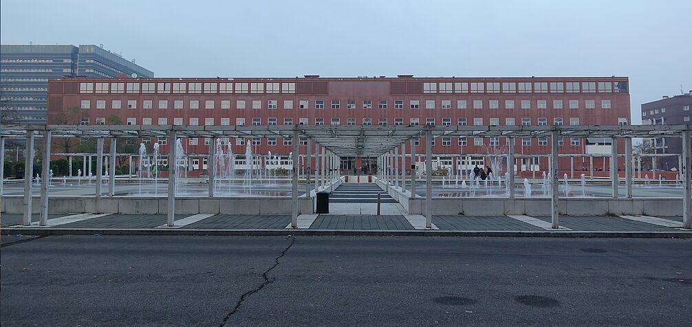 office building behind water fountains