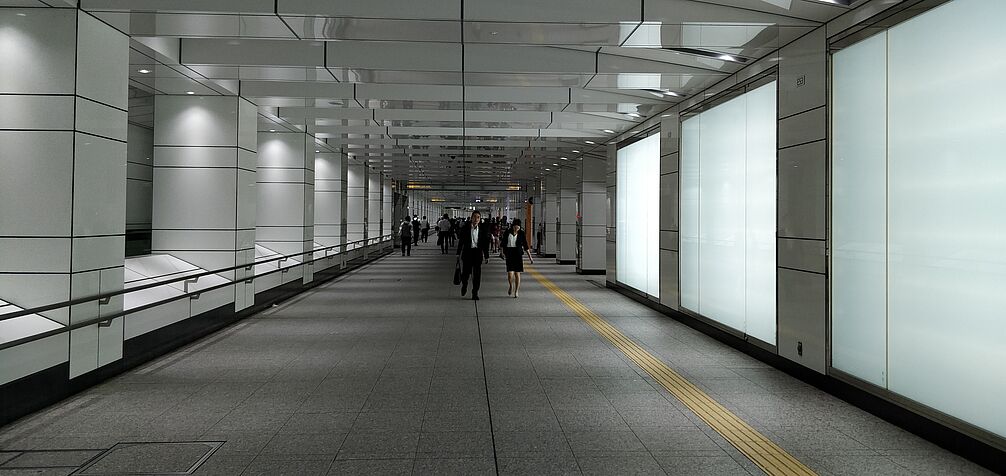 pedestrians in undergound station after work